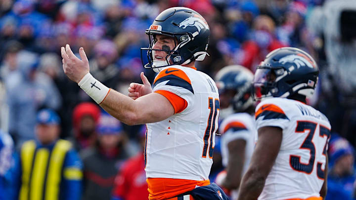 Denver Broncos quarterback Bo Nix (10) signals to the players before the snap during the first half of the Buffalo Bills wild card game against the Denver Broncos at Highmark Stadium in Orchard Park on Jan. 12, 2025.