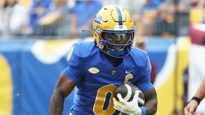Sep 6, 2025; Pittsburgh, Pennsylvania, USA;  Pittsburgh Panthers running back Desmond Reid (0) carries the ball against the Central Michigan Chippewas during the first quarter at Acrisure Stadium. Mandatory Credit: Charles LeClaire-Imagn Images