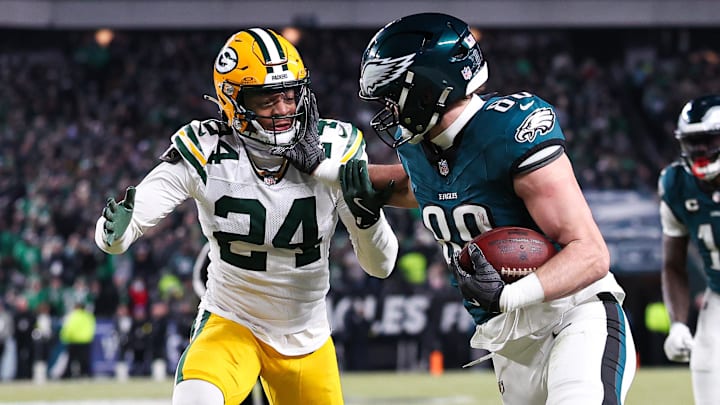 Jan 12, 2025; Philadelphia, Pennsylvania, USA; Philadelphia Eagles tight end Dallas Goedert (88) runs with the ball against Green Bay Packers cornerback Carrington Valentine (24) after a catch in an NFC wild card game at Lincoln Financial Field. Mandatory Credit: Bill Streicher-Imagn Images