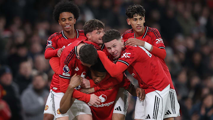 Kai Rooney (centre) made his first competitive appearance at Old Trafford on Friday.