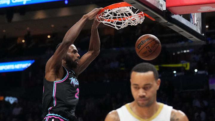 Jan 4, 2026; Miami, Florida, USA; Miami Heat forward Andrew Wiggins (22) dunks as New Orleans Pelicans guard Bryce McGowens (11) walks away during the first half at Kaseya Center. Mandatory Credit: Jim Rassol-Imagn Images Jan 4, 2026; Miami, Florida, USA; Miami Heat forward Andrew Wiggins (22) dunks as New Orleans Pelicans guard Bryce McGowens (11) walks away during the first half at Kaseya Center. Mandatory Credit: Jim Rassol-Imagn Images