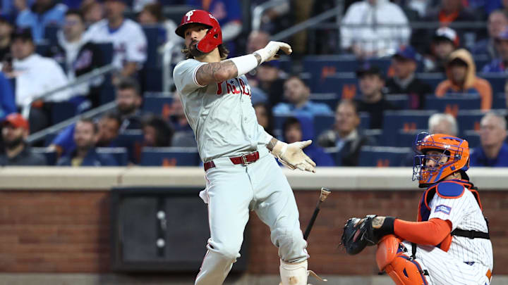 Oct 9, 2024; New York, New York, USA; Philadelphia Phillies outfielder Nick Castellanos (8) hits a double in the fourth inning against the New York Mets in game four of the NLDS for the 2024 MLB Playoffs at Citi Field. 