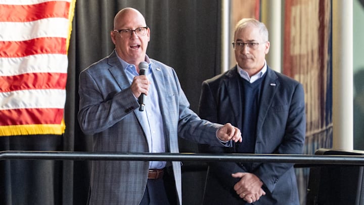 Apr 15, 2025; Saint Paul, Minnesota, USA; Prior to the game between the Minnesota Wild and Anaheim Ducks, Bob Motzko is announced as the head coach for the 2026 IIHF World Junior Hockey Championship by John Vanbiesbrouck (right). The ceremony was held at Xcel Energy Center. Mandatory Credit: Matt Blewett-Imagn Images