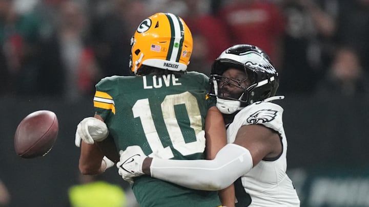 The Eagles' Josh Sweat wraps up Packers QB Jordan Love toward the end of their Week 1 game.