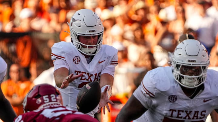 Texas Longhorns quarterback Quinn Ewers (3) snaps the ball during the Red River Rivalry game against Oklahoma at the Cotton Bowl on Saturday, Oct. 12, 2024 in Dallas, Texas.