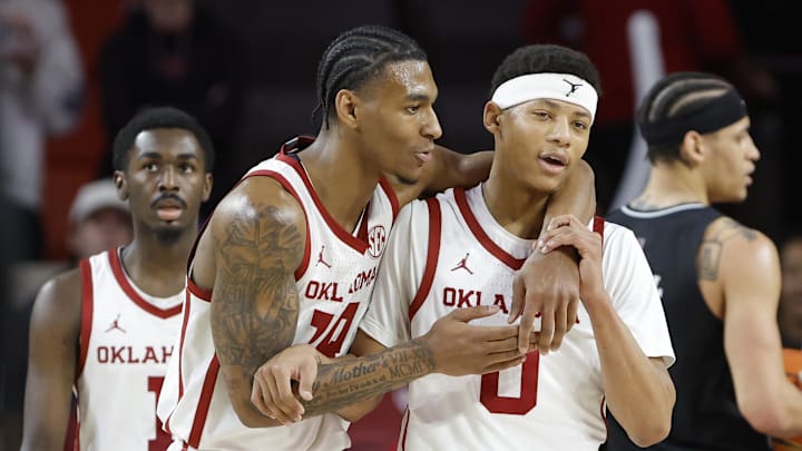 Feb 22, 2025; Norman, Oklahoma, USA; Oklahoma Sooners forward Jalon Moore (14) and guard Jeremiah Fears (0) react after a play against the Mississippi State Bulldogs during the second half at Lloyd Noble Center. Mandatory Credit: Alonzo Adams-Imagn Images