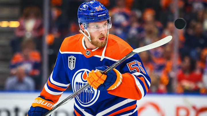 Jun 21, 2024; Edmonton, Alberta, CAN; Edmonton Oilers left wing Dylan Holloway (55) controls the puck during the warmup period against the Florida Panthers in game six of the 2024 Stanley Cup Final at Rogers Place. Mandatory Credit: Sergei Belski-Imagn Images