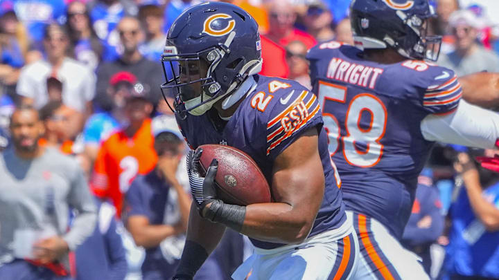Former Chicago Bears running back Khalil Herbert (24) runs with the ball against the Buffalo Bills during the first half at Highmark Stadium.