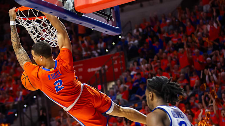 Florida Gators guard Riley Kugel (2) slam dunks the ball. The Florida men   s basketball team hosted