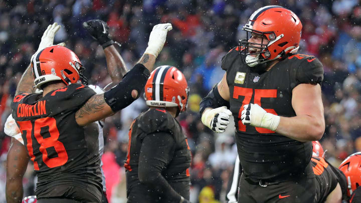 Browns guard Joel Bitonio (75) and tackle Jack Conklin (78) celebrate after Nick Chubb scored the game-winning touchdown in overtime against the Buccaneers, Sunday, Nov. 27, 2022, in Cleveland.

Browns27jl 8