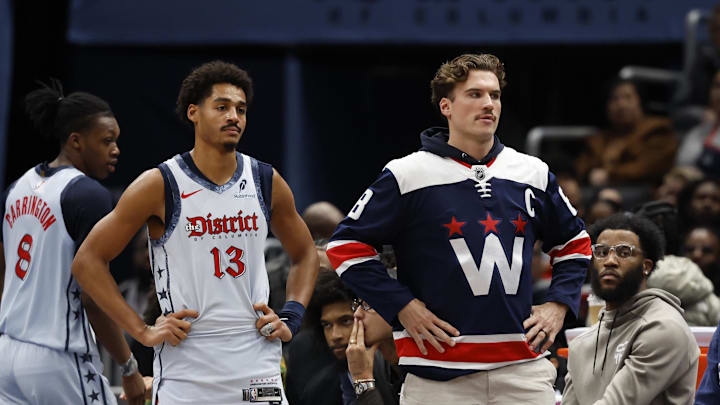 Dec 8, 2024; Washington, District of Columbia, USA; Washington Wizards guard Jordan Poole (13) and injured Wizards forward Corey Kispert (R) look on from the bench against the Memphis Grizzlies in the third quarter at Capital One Arena. Mandatory Credit: Geoff Burke-Imagn Images Dec 8, 2024; Washington, District of Columbia, USA; Washington Wizards guard Jordan Poole (13) and injured Wizards forward Corey Kispert (R) look on from the bench against the Memphis Grizzlies in the third quarter at Capital One Arena. Mandatory Credit: Geoff Burke-Imagn Images