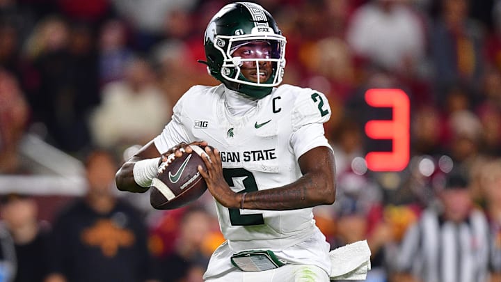 Sep 20, 2025; Los Angeles, California, USA; Michigan State Spartans quarterback Aidan Chiles (2) drops back to pass against the Southern California Trojans during the second half at the Los Angeles Memorial Coliseum. Mandatory Credit: Gary A. Vasquez-Imagn Images Sep 20, 2025; Los Angeles, California, USA; Michigan State Spartans quarterback Aidan Chiles (2) drops back to pass against the Southern California Trojans during the second half at the Los Angeles Memorial Coliseum. Mandatory Credit: Gary A. Vasquez-Imagn Images