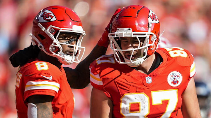Nov 10, 2024; Kansas City, Missouri, USA; Kansas City Chiefs tight end Travis Kelce (87) is congratulated by wide receiver DeAndre Hopkins (8) after scoring a touchdown during the first half against the Denver Broncos at GEHA Field at Arrowhead Stadium. Mandatory Credit: Jay Biggerstaff-Imagn Images