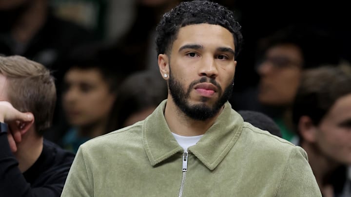Jan 23, 2026; Brooklyn, New York, USA; Boston Celtics injured forward Jayson Tatum (0) watches from the bench during the first quarter against the Brooklyn Nets at Barclays Center. Mandatory Credit: Brad Penner-Imagn Images