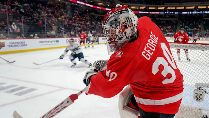 Jan 5, 2026; St. Paul, Minnesota, USA; Canada goalie Carter George (30) shoots the puck around the boards during the third period in the third place game of the 2026 IIHF World Junior Championship ice hockey tournament at Grand Casino Arena. Mandatory Credit: Nick Wosika-Imagn Images Jan 5, 2026; St. Paul, Minnesota, USA; Canada goalie Carter George (30) shoots the puck around the boards during the third period in the third place game of the 2026 IIHF World Junior Championship ice hockey tournament at Grand Casino Arena. Mandatory Credit: Nick Wosika-Imagn Images