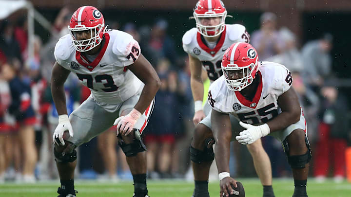 Nov 9, 2024; Oxford, Mississippi, USA; Georgia Bulldogs offensive lineman Xavier Truss (73) and offensive lineman Jared Wilson (55) wait for the snap during the first half against the Mississippi Rebels at Vaught-Hemingway Stadium. Mandatory Credit: Petre Thomas-Imagn Images