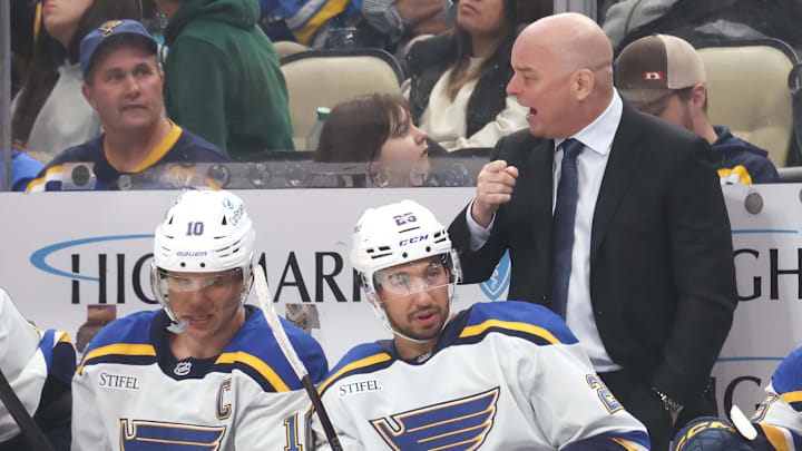 Mar 13, 2025; Pittsburgh, Pennsylvania, USA; St. Louis Blues head coach Jim Montgomery (right) gestures on the bench against the Pittsburgh Penguins during the third period at PPG Paints Arena. Mandatory Credit: Charles LeClaire-Imagn Images