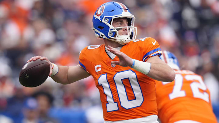 Oct 26, 2025; Denver, Colorado, USA; Denver Broncos quarterback Bo Nix (10) throws a pass against the Dallas Cowboys in the first quarter at Empower Field at Mile High. Mandatory Credit: Ron Chenoy-Imagn Images