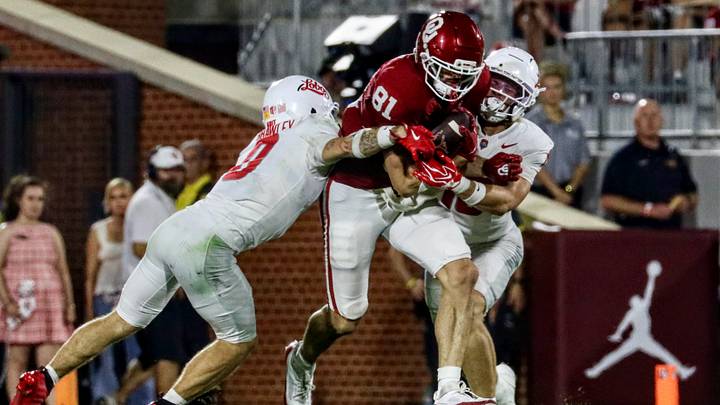Oklahoma tight end Rocky Beers tries to evade two New Mexico defenders. Oklahoma tight end Rocky Beers tries to evade two New Mexico defenders.