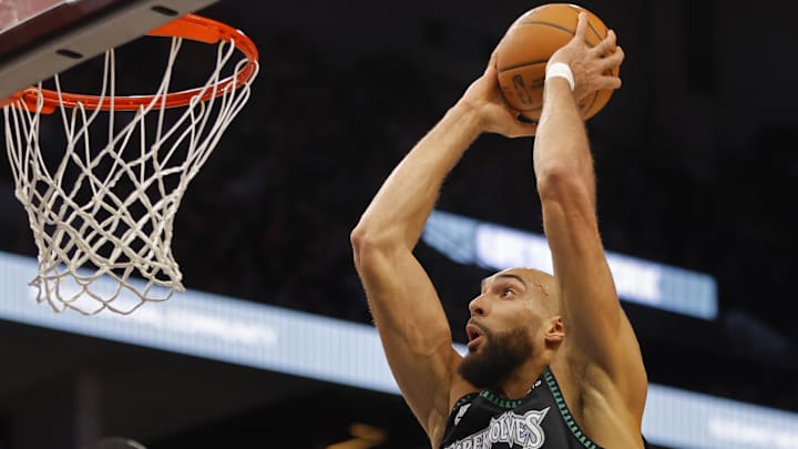 Jan 6, 2026; Minneapolis, Minnesota, USA; Minnesota Timberwolves center Rudy Gobert (27) dunks against the Miami Heat in the first quarter at Target Center.