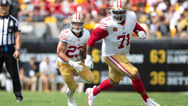 San Francisco 49ers running back Christian McCaffrey (23) and offensive tackle Trent Williams (71)