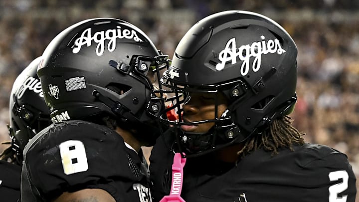 Oct 26, 2024; College Station, Texas, USA; Texas A&M Aggies running back Le'Veon Moss (8) celebrates after scoring a touchdown with running back Rueben Owens (2) against the LSU Tigers in the fourth quarter at Kyle Field. Mandatory Credit: Maria Lysaker-Imagn Images. 