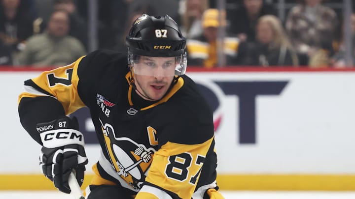 Dec 21, 2025; Pittsburgh, Pennsylvania, USA;  Pittsburgh Penguins center Sidney Crosby (87) skates up ice with the puck against the Montréal Canadiens during the first period at PPG Paints Arena. Mandatory Credit: Charles LeClaire-Imagn Images