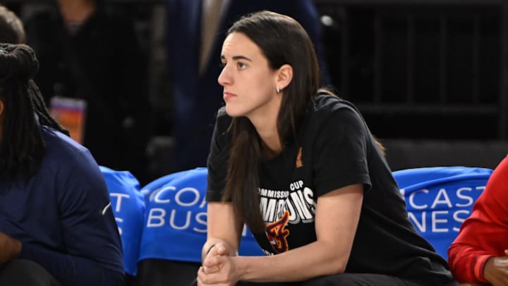 Sep 7, 2025; Baltimore, MD, USA; Indiana Fever guard Caitlin Clark (22) looks on from the bench against the Washington Mystics during the first quarter at CFG Bank Arena. Mandatory Credit: Rafael Suanes-Imagn Images