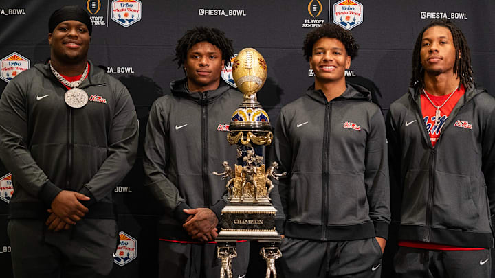 Left to right: Ole Miss defensive lineman Will Echoles, running back Kewan Lacy, quarterback Trinidad Chambliss and linebacker TJ Dottery pose for photos during the CFP and Fiesta Bowl Media Day at the JW Marriott Scottsdale Camelback Inn Resort & Spa, in Scottsdale, Ariz., on Tuesday, Jan. 6, 2026.