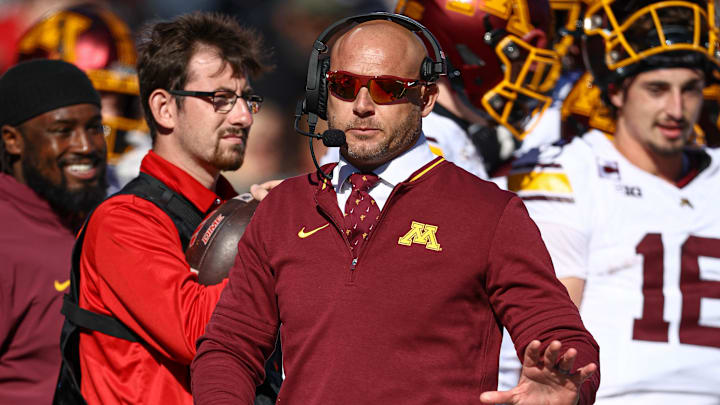 Nov 9, 2024; Piscataway, New Jersey, USA; Minnesota Golden Gophers head coach T. J. Fleck looks on during the first half against the Rutgers Scarlet Knights at SHI Stadium. Mandatory Credit: Vincent Carchietta-Imagn Images Nov 9, 2024; Piscataway, New Jersey, USA; Minnesota Golden Gophers head coach T. J. Fleck looks on during the first half against the Rutgers Scarlet Knights at SHI Stadium. Mandatory Credit: Vincent Carchietta-Imagn Images