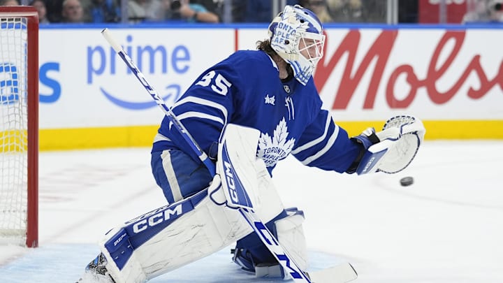 Dec 8, 2025; Toronto, Ontario, CAN; Toronto Maple Leafs goaltender Dennis Hildeby (35) goes to make a glove save against the Tampa Bay Lightning during the second period at Scotiabank Arena. Mandatory Credit: John E. Sokolowski-Imagn Images