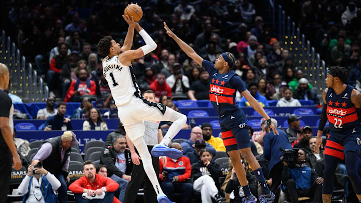 Feb 10, 2025; Washington, District of Columbia, USA; San Antonio Spurs center Victor Wembanyama (1) takes a shot over Washington Wizards guard Bilal Coulibaly (0) during the first quarter at Capital One Arena.
