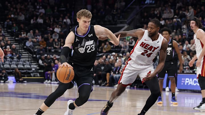 Jan 9, 2025; Salt Lake City, Utah, USA; Utah Jazz forward Lauri Markkanen (23) dribbles the ball past Miami Heat forward Haywood Highsmith (24) during the second half at Delta Center. Mandatory Credit: Chris Nicoll-Imagn Images Jan 9, 2025; Salt Lake City, Utah, USA; Utah Jazz forward Lauri Markkanen (23) dribbles the ball past Miami Heat forward Haywood Highsmith (24) during the second half at Delta Center. Mandatory Credit: Chris Nicoll-Imagn Images