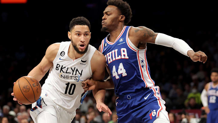 Feb 11, 2023; Brooklyn, New York, USA; Brooklyn Nets guard Ben Simmons (10) drives to the basket against Philadelphia 76ers forward Paul Reed (44) during the fourth quarter at Barclays Center. Mandatory Credit: Brad Penner-Imagn Images