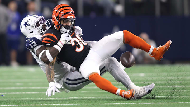 Dec 9, 2024; Arlington, Texas, USA; Dallas Cowboys linebacker DeMarvion Overshown (13) breaks up a pass intended for Cincinnati Bengals running back Chase Brown (30) on fourth down in the second quarter at AT&T Stadium. Mandatory Credit: Tim Heitman-Imagn Images