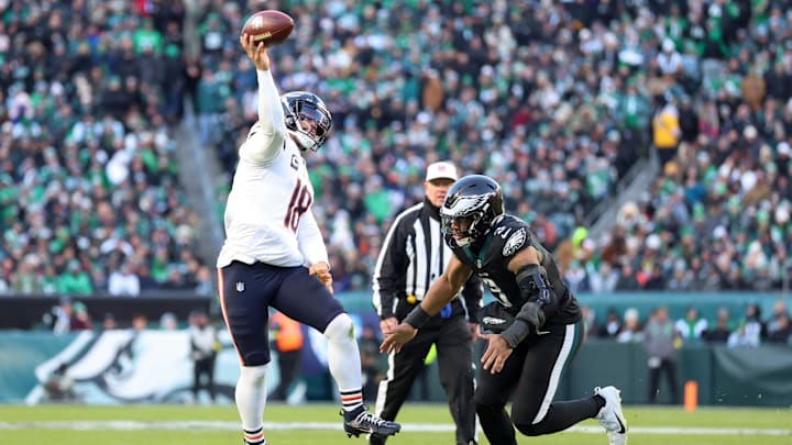 Nov 28, 2025; Philadelphia, Pennsylvania, USA; Chicago Bears quarterback Caleb Williams (18) passes the ball under pressure from Philadelphia Eagles linebacker Nolan Smith Jr. (3) during the first quarter of the game at Lincoln Financial Field. Mandatory Credit: Bill Streicher-Imagn Images