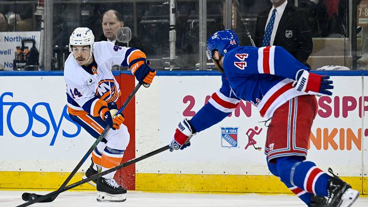 Jan 29, 2026; New York, New York, USA;  New York Islanders center Jean-Gabriel Pageau (44) attempts a pass defended by New York Rangers defenseman Vladislav Gavrikov (44) during the second period at Madison Square Garden. Mandatory Credit: Dennis Schneidler-Imagn Images