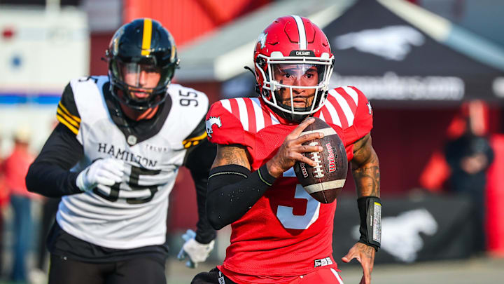 Jun 7, 2025; Calgary, Alberta, Canada; Calgary Stampeders quarterback Vernon Adams Jr (3) runs with the ball against the Hamilton Tiger-Cats during the second half at McMahon Stadium. Mandatory Credit: Sergei Belski-Imagn Images