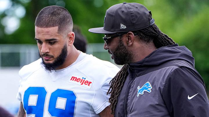 Detroit Lions defensive end Ahmed Hassanein (99), left, talks to defensive coordinator Kelvin Sheppard after practice during mini camp at Meijer Performance Center in Allen Park on Tuesday, June 16, 2026. Detroit Lions defensive end Ahmed Hassanein (99), left, talks to defensive coordinator Kelvin Sheppard after practice during mini camp at Meijer Performance Center in Allen Park on Tuesday, June 16, 2026.