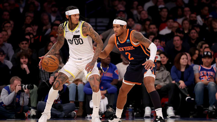 Jan 30, 2024; New York, New York, USA; Utah Jazz guard Jordan Clarkson (00) controls the ball against New York Knicks guard Miles McBride (2) during the first quarter at Madison Square Garden. Mandatory Credit: Brad Penner-Imagn Images