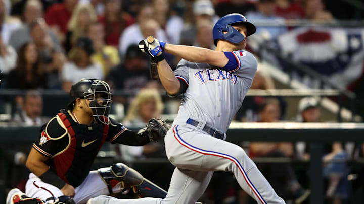 Oct 31, 2023; Phoenix, Arizona, USA; Texas Rangers shortstop Corey Seager (5) hits a two run home