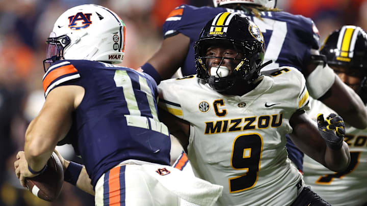 Oct 18, 2025; Auburn, Alabama, USA; Missouri Tigers defensive end Zion Young (9) moves in to tackle Auburn Tigers quarterback Jackson Arnold (11) during the fourth quarter at Jordan-Hare Stadium.  Mandatory Credit: John Reed-Imagn Images