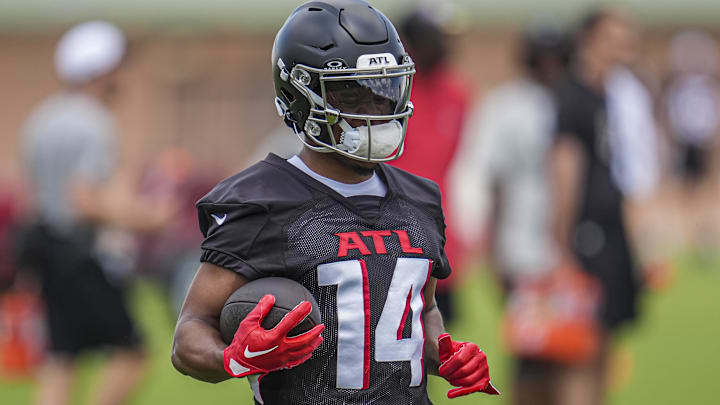 Jun 3, 2024; Atlanta, GA, USA; Atlanta Falcons wide receiver Rondale Moore (14) runs with the ball during Falcons OTA at the Falcons Training facility. 