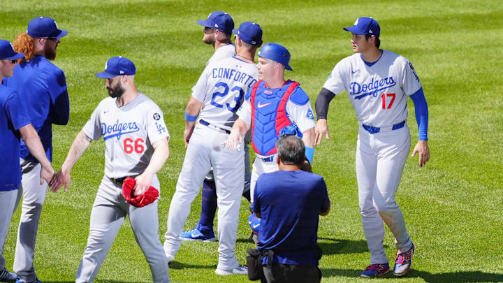 Jun 26, 2025; Denver, Colorado, USA; Los Angeles Dodgers relief pitcher Tanner Scott (66) and designated hitter player Shohei Ohtani (17), and catcher Will Smith (16) and outfielder Michael Conforto (23) celebrate defeating the Colorado Rockies at Coors Field. Mandatory Credit: Ron Chenoy-Imagn Images