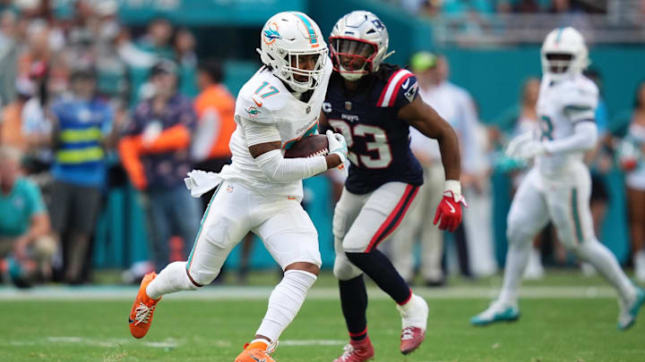 Miami Dolphins wide receiver Jaylen Waddle (17) runs with the ball after a catch against the New England Patriots during the first half at Hard Rock Stadium.