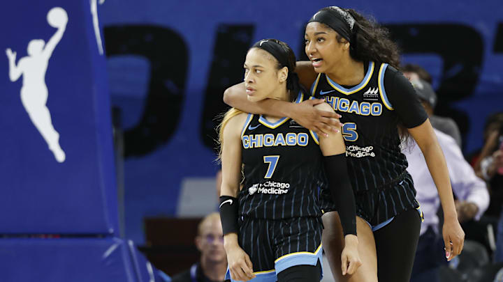 Aug 25, 2024; Chicago, Illinois, USA; Chicago Sky guard Chennedy Carter (7) reacts next to forward Angel Reese (5) after scoring against the Las Vegas Aces during the second half at Wintrust Arena. Mandatory Credit: Kamil Krzaczynski-Imagn Images