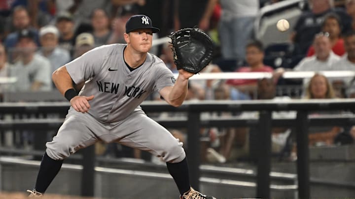 Aug 27, 2024; Washington, District of Columbia, USA; New York Yankees third baseman DJ LeMahieu (26) fields the ball at first base against the Washington Nationals during the sixth inning at Nationals Park. Mandatory Credit: Rafael Suanes-Imagn Images