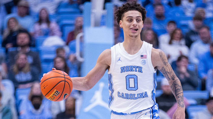 Dec 16, 2025; Chapel Hill, North Carolina, USA; North Carolina Tar Heels guard Kyan Evans (0) brings the ball up court during the second half against the ETSU Buccaneers at Dean E. Smith Center. Mandatory Credit: Scott Kinser-Imagn Images Dec 16, 2025; Chapel Hill, North Carolina, USA; North Carolina Tar Heels guard Kyan Evans (0) brings the ball up court during the second half against the ETSU Buccaneers at Dean E. Smith Center. Mandatory Credit: Scott Kinser-Imagn Images