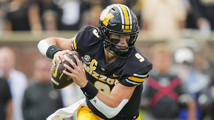 Sep 6, 2025; Columbia, Missouri, USA; Missouri Tigers quarterback Beau Pribula (9) rolls out to pass during the first half against the Kansas Jayhawks at Faurot Field at Memorial Stadium. Mandatory Credit: Jay Biggerstaff-Imagn Images Sep 6, 2025; Columbia, Missouri, USA; Missouri Tigers quarterback Beau Pribula (9) rolls out to pass during the first half against the Kansas Jayhawks at Faurot Field at Memorial Stadium. Mandatory Credit: Jay Biggerstaff-Imagn Images