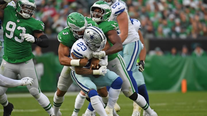  Philadelphia Eagles linebacker Nolan Smith Jr.  and  linebacker Oren Burks  stop Dallas Cowboys running back Rico Dowdle